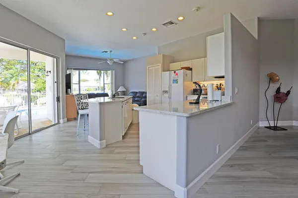 a view of kitchen with furniture and wooden floor