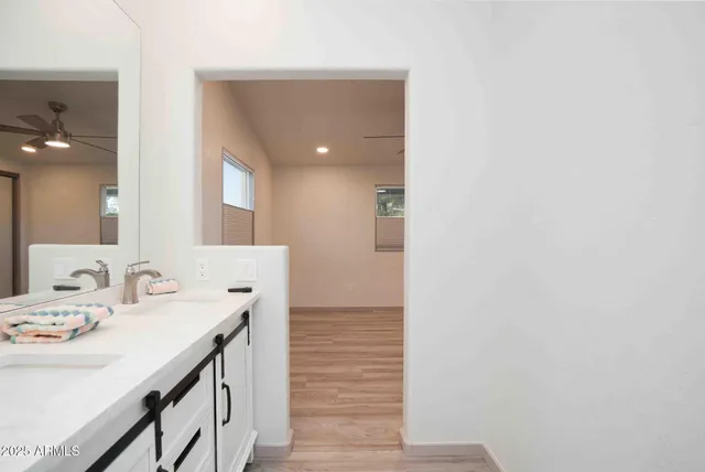 a bathroom with a sink and a mirror