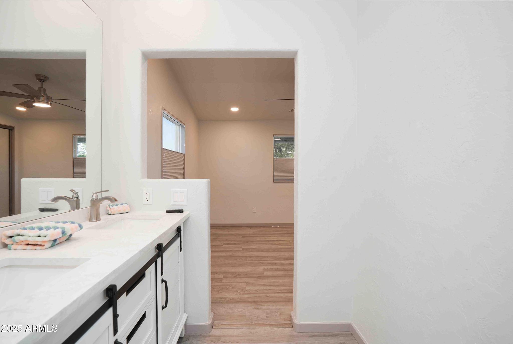 6770 West State Rte 89A, Unit 15 Sedona, AZ 86336 - Photo 13 of 27 a bathroom with a sink and a mirror