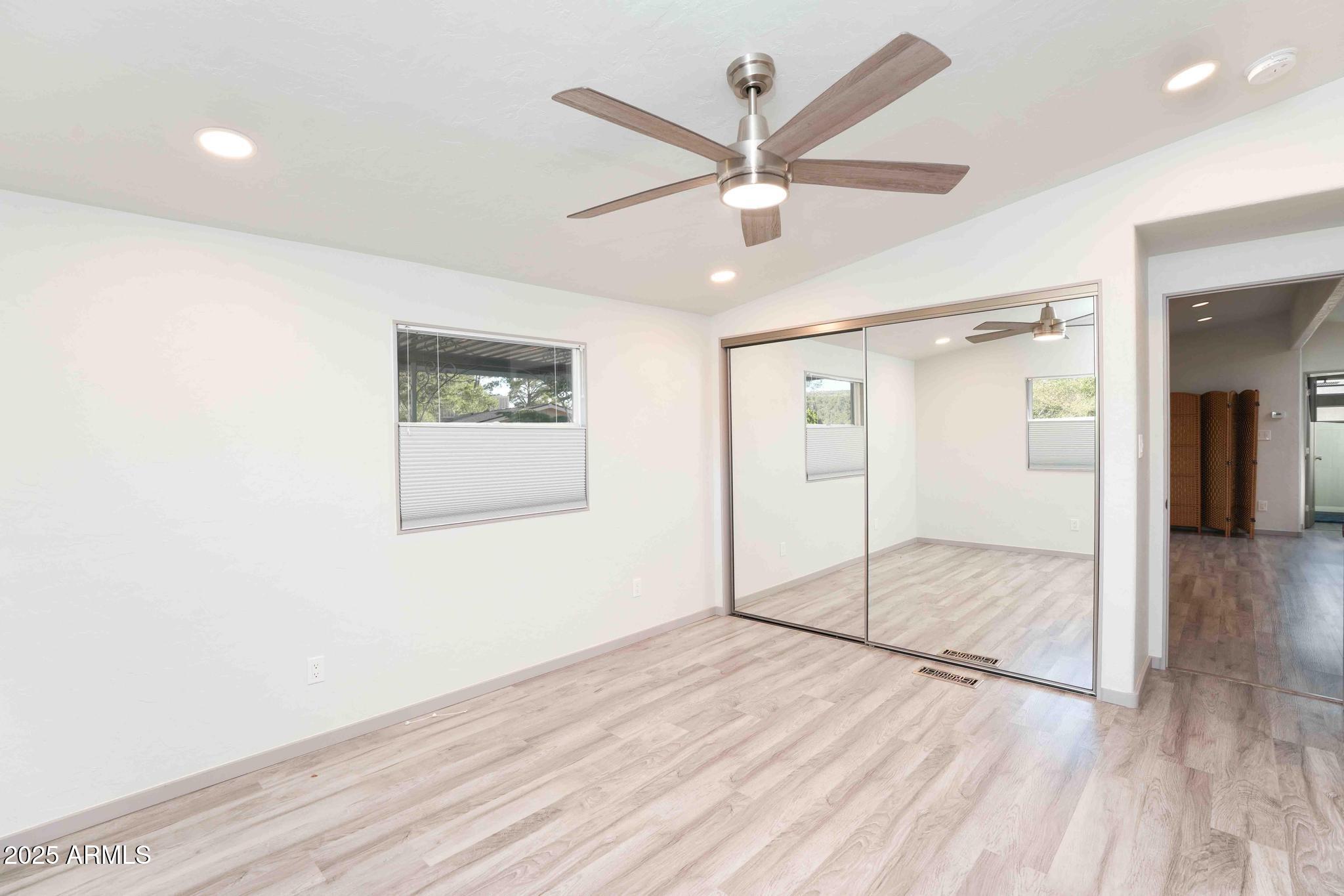 6770 West State Rte 89A, Unit 15 Sedona, AZ 86336 - Photo 14 of 27 a view of empty room with wooden floor
