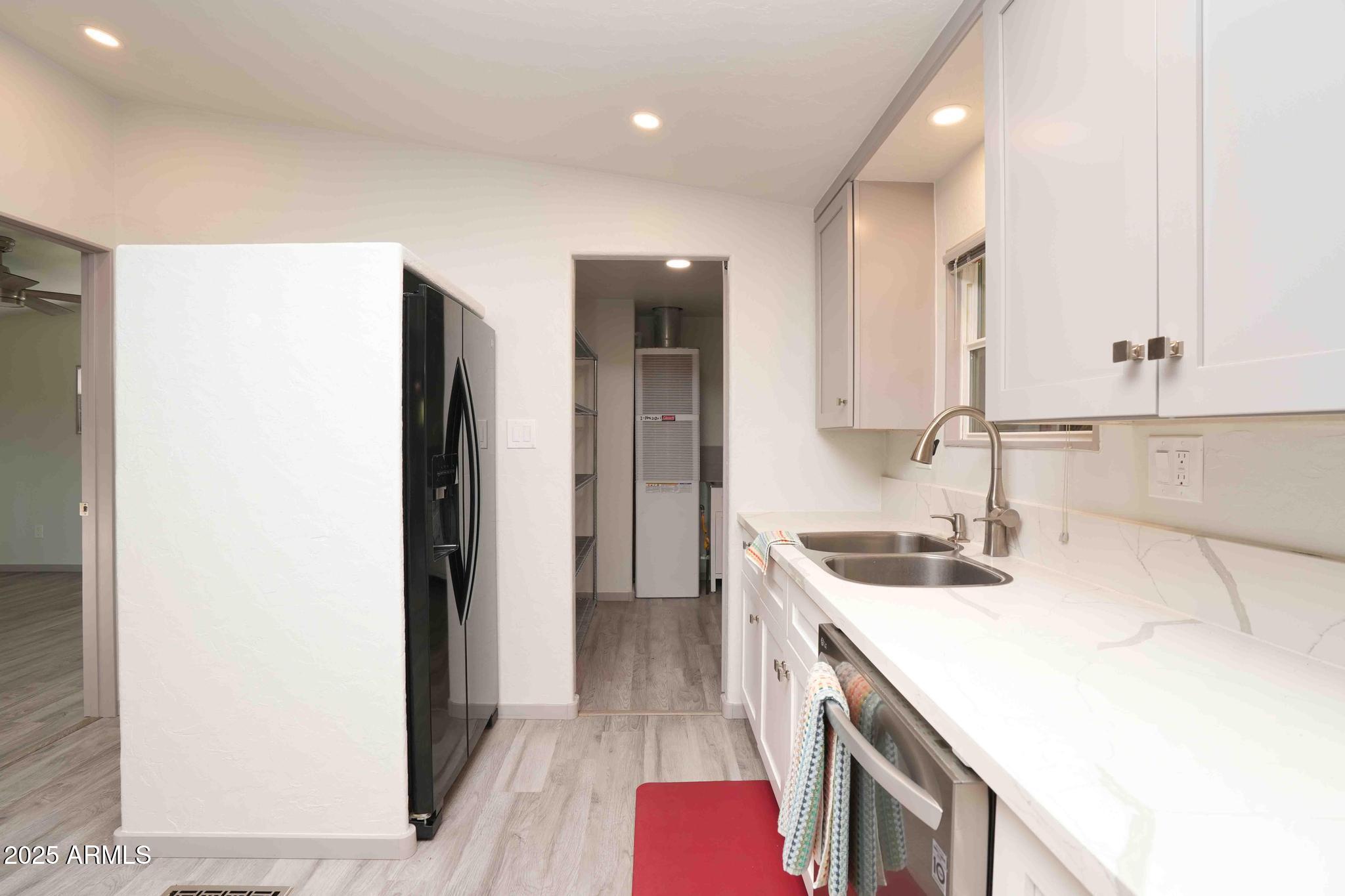 6770 West State Rte 89A, Unit 15 Sedona, AZ 86336 - Photo 4 of 27 a kitchen with a sink a stove and a refrigerator