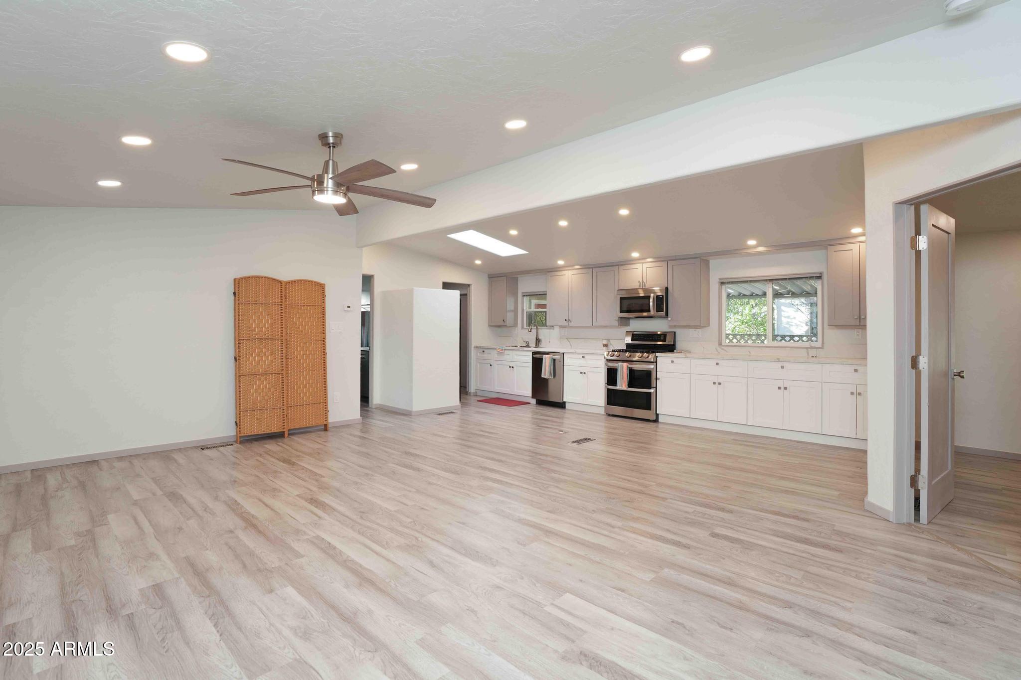 6770 West State Rte 89A, Unit 15 Sedona, AZ 86336 - Photo 6 of 27 a view of a kitchen with a dishwasher and a refrigerator