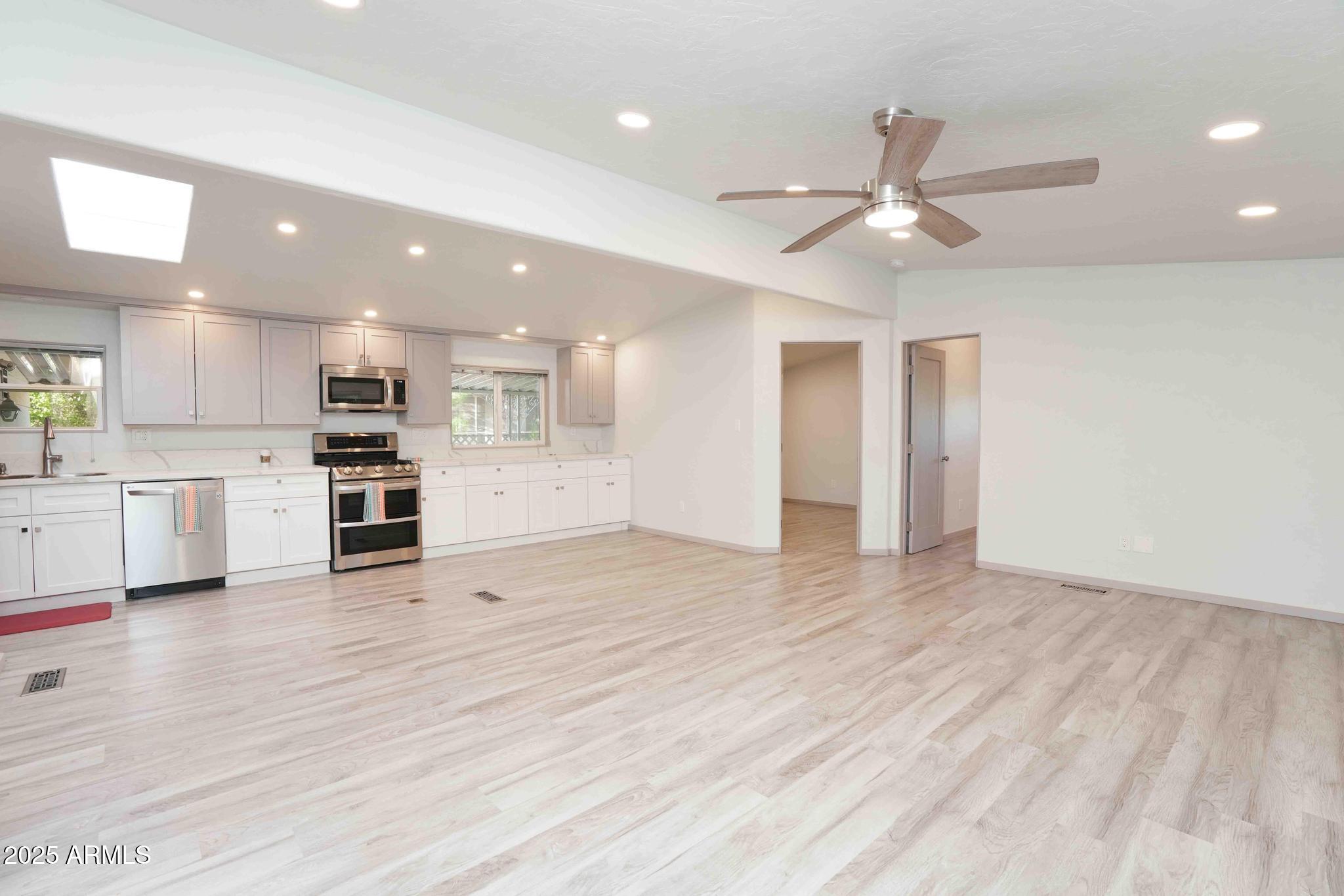 6770 West State Rte 89A, Unit 15 Sedona, AZ 86336 - Photo 7 of 27 a view of kitchen with refrigerator stove and cabinets