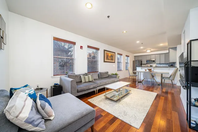 a living room with furniture and a table