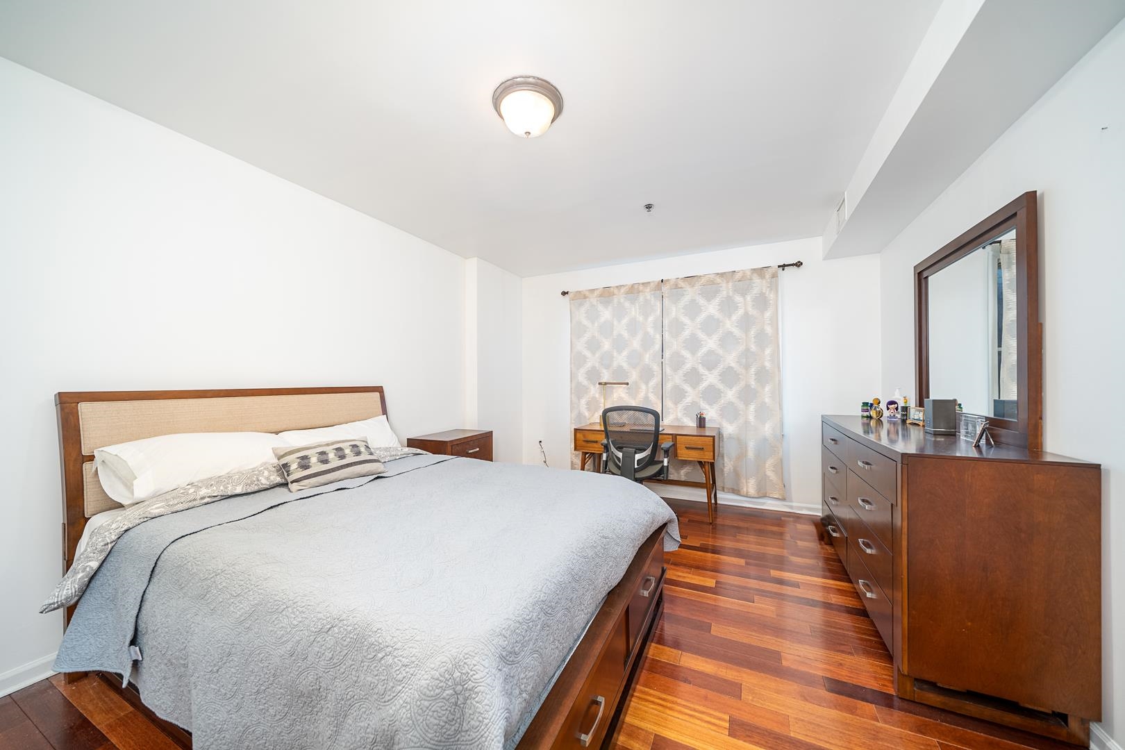 650 2nd Street, Unit 2K Hoboken, NJ 07030 - Photo 14 of 23 a bedroom with bed and wooden floor