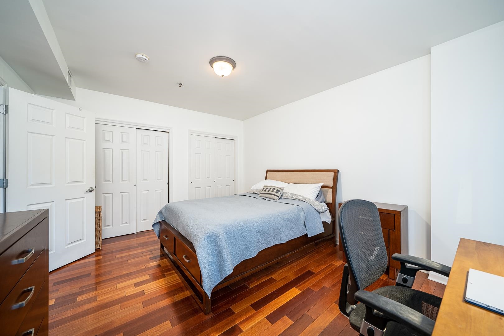 650 2nd Street, Unit 2K Hoboken, NJ 07030 - Photo 17 of 23 a bedroom with a bed and a chair