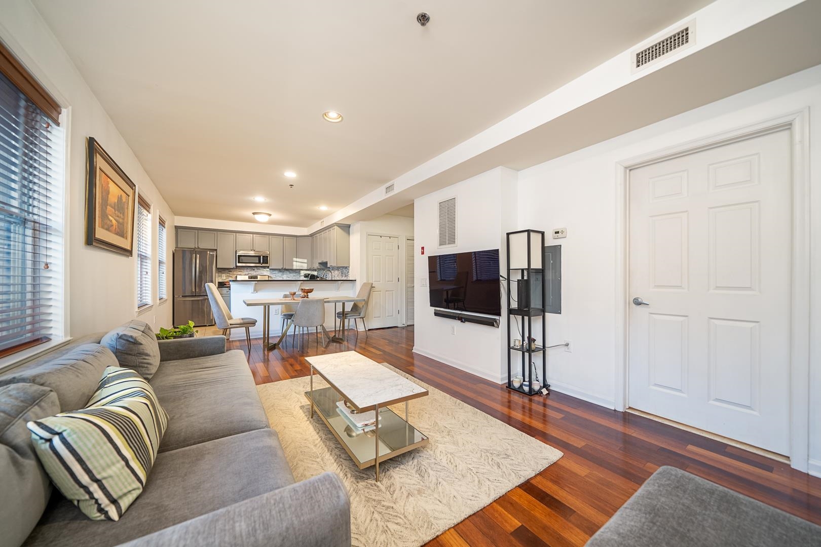 650 2nd Street, Unit 2K Hoboken, NJ 07030 - Photo 2 of 23 a living room with furniture and a flat screen tv