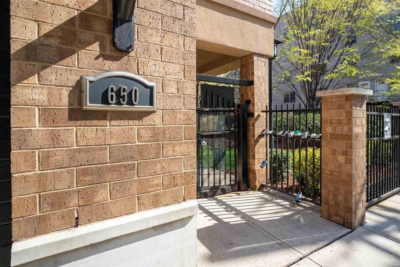 650 2nd Street, Unit 2K Hoboken, NJ 07030 - Photo 21 of 23 a view of a brick house with a large windows