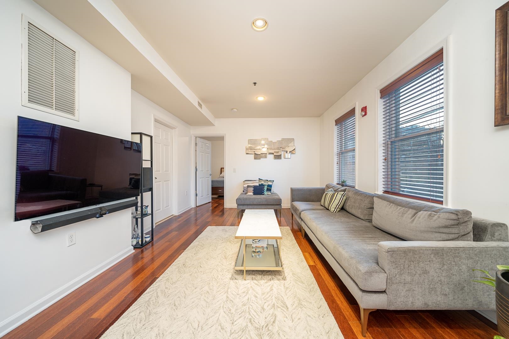 650 2nd Street, Unit 2K Hoboken, NJ 07030 - Photo 3 of 23 a living room with furniture and a flat screen tv