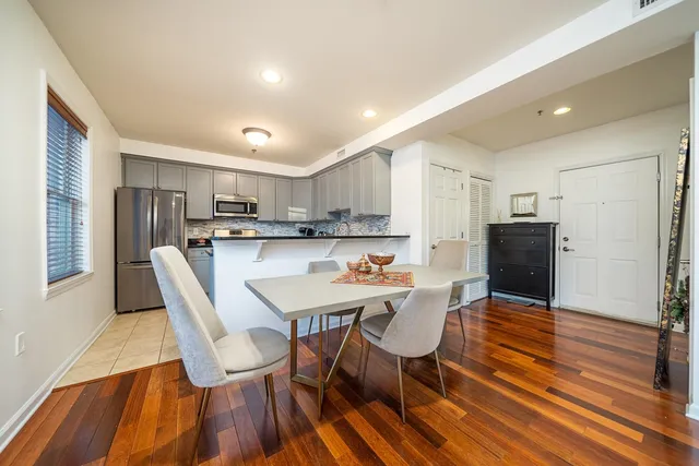 a view of a dining room with furniture and wooden floor