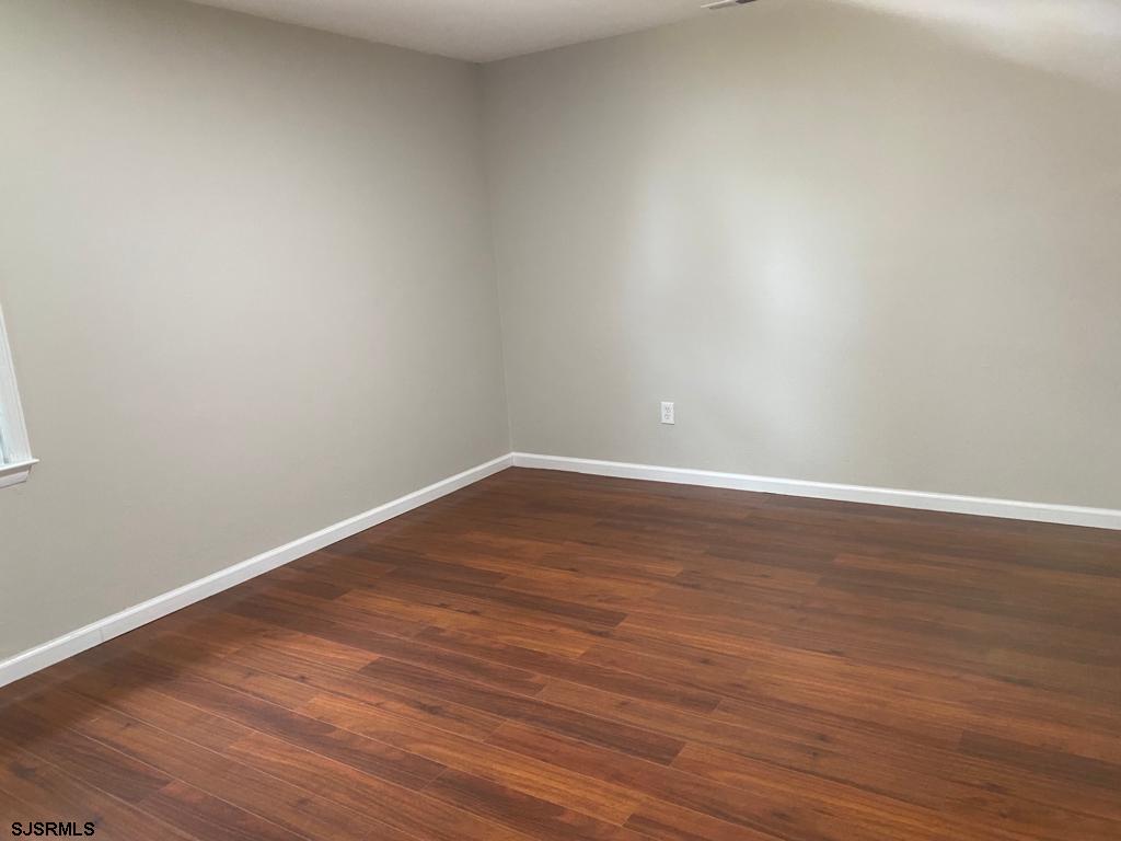 1564 Old Egg Harbor Road Mays Landing, NJ 08330 - Photo 6 of 11 a view of an empty room with wooden floor