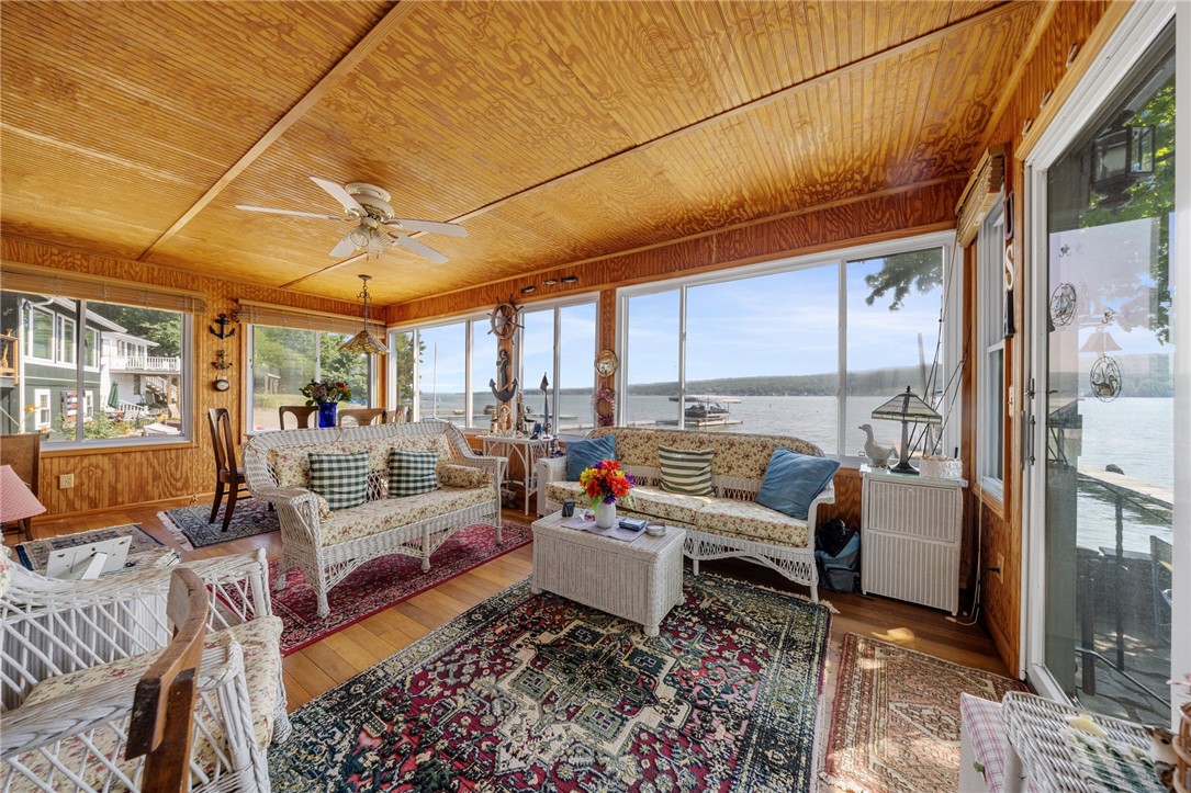 5317 West Lake Road Geneseo, NY 14454 - Photo 18 of 50 SPECTACULAR SUNROOM WITH WALL OF WINDOWS & LAKE VI