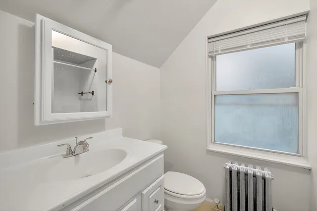 a bathroom with a bathtub a toilet and a sink