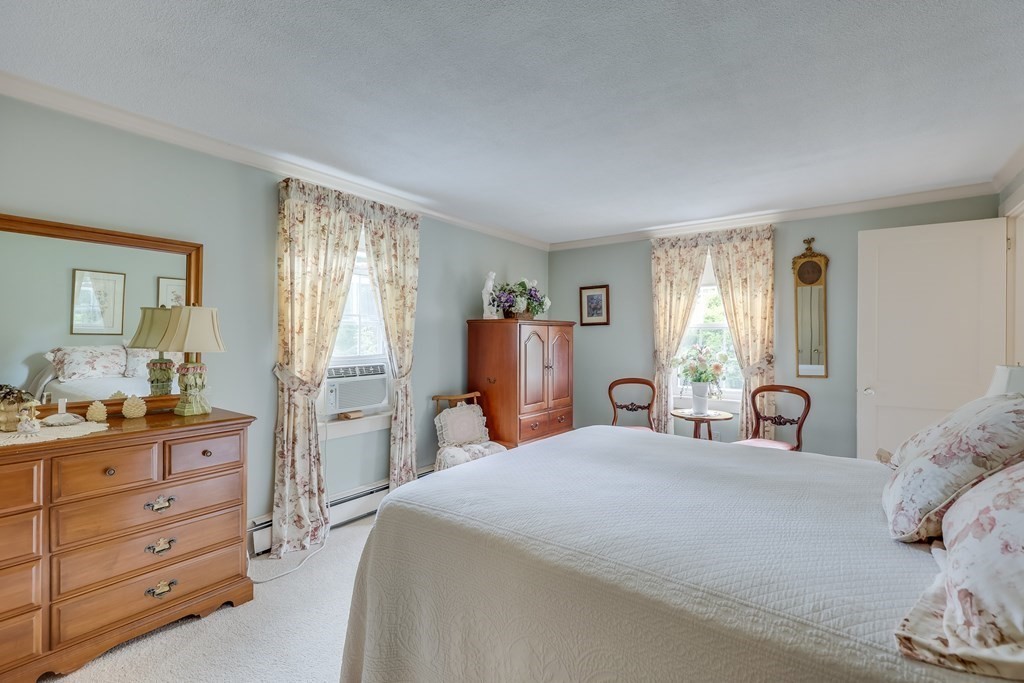 208 Osterville West Barnstable Road Barnstable, MA 02655 - Photo 13 of 27 a bedroom with a large bed and a dresser