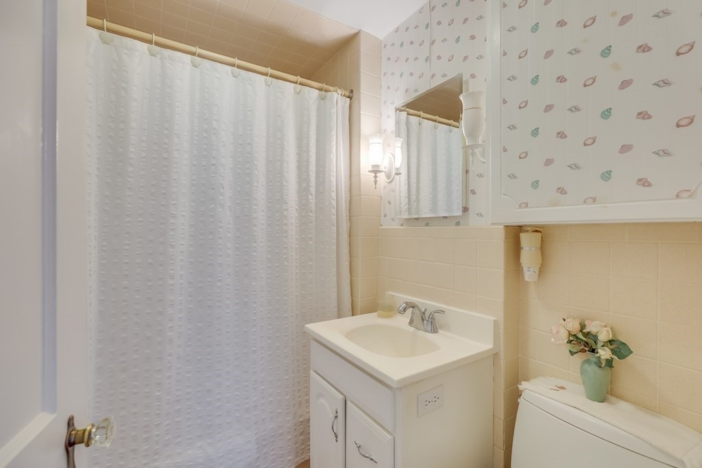 208 Osterville West Barnstable Road Barnstable, MA 02655 - Photo 14 of 27 a bathroom with a sink and a mirror
