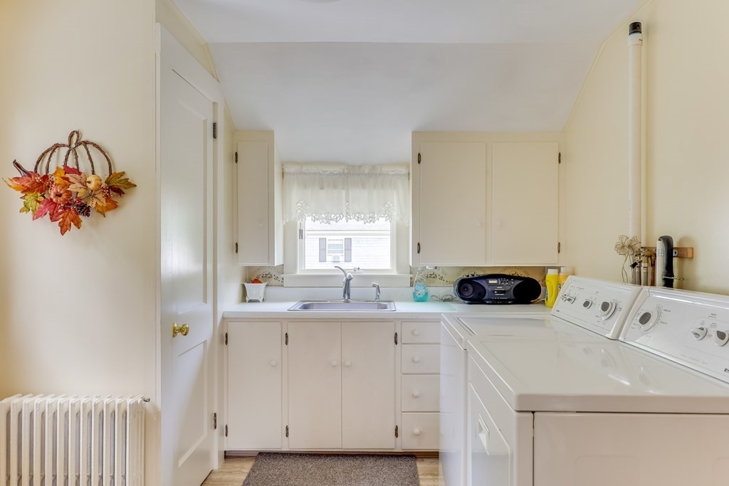 208 Osterville West Barnstable Road Barnstable, MA 02655 - Photo 18 of 27 a utility room with a sink a cabinetry and a window