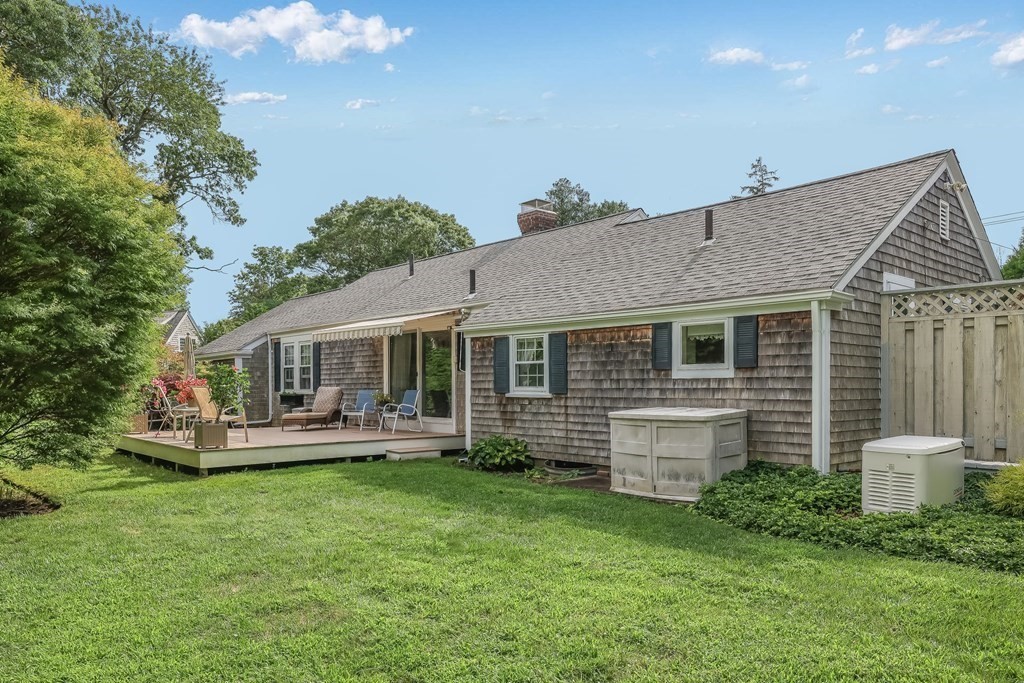 208 Osterville West Barnstable Road Barnstable, MA 02655 - Photo 2 of 27 a front view of a house with a yard and green space