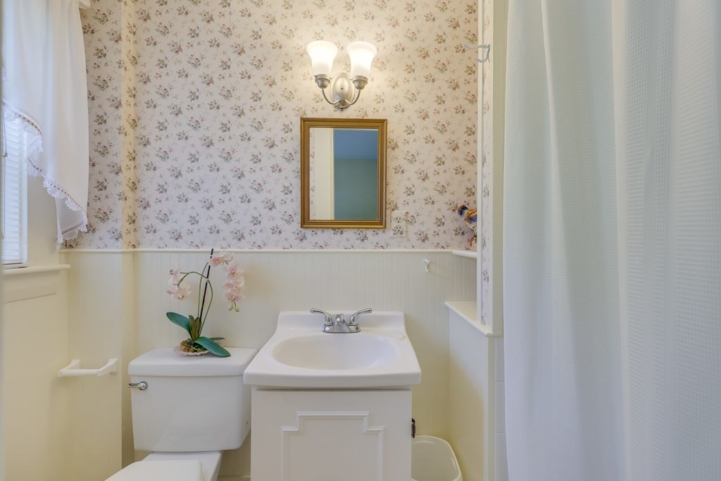 208 Osterville West Barnstable Road Barnstable, MA 02655 - Photo 21 of 27 a bathroom with a sink a toilet and mirror