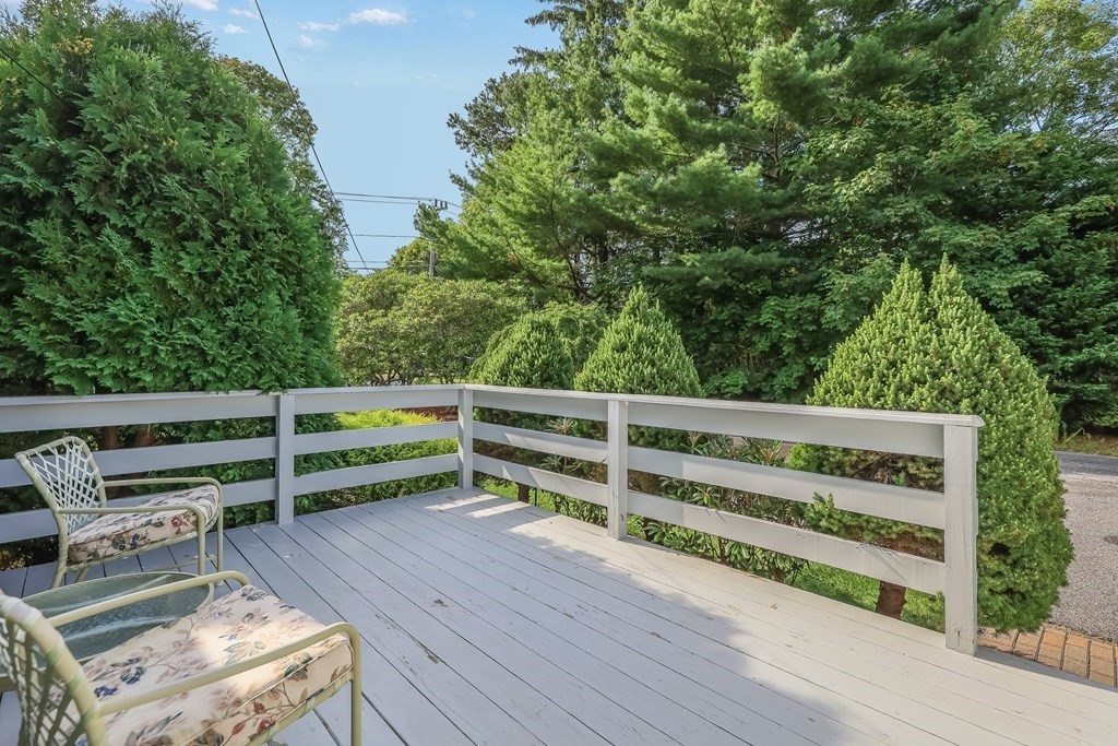 208 Osterville West Barnstable Road Barnstable, MA 02655 - Photo 23 of 27 a view of a wooden deck and trees