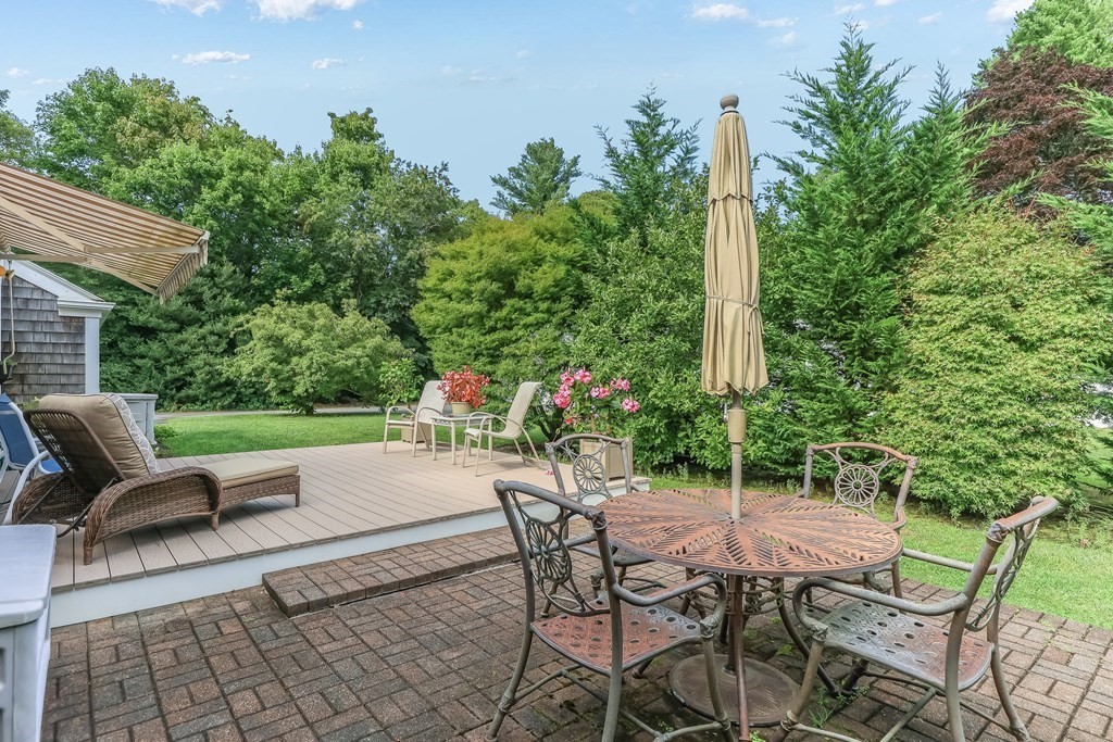 208 Osterville West Barnstable Road Barnstable, MA 02655 - Photo 24 of 27 a view of a patio with table and chairs and potted plants