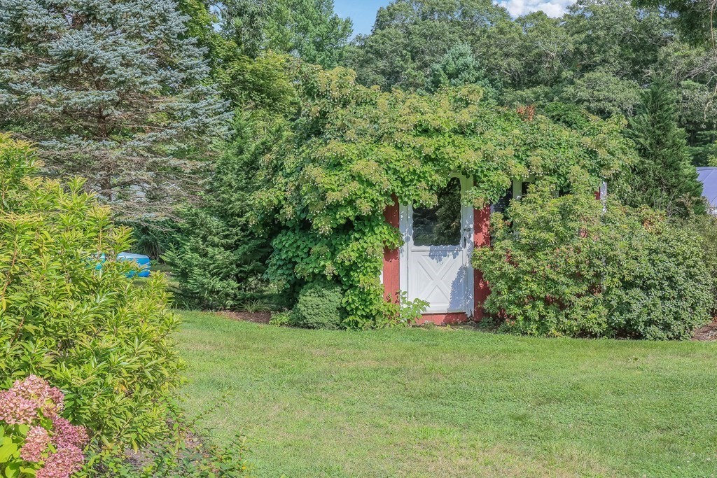 208 Osterville West Barnstable Road Barnstable, MA 02655 - Photo 26 of 27 a view of a garden with large trees