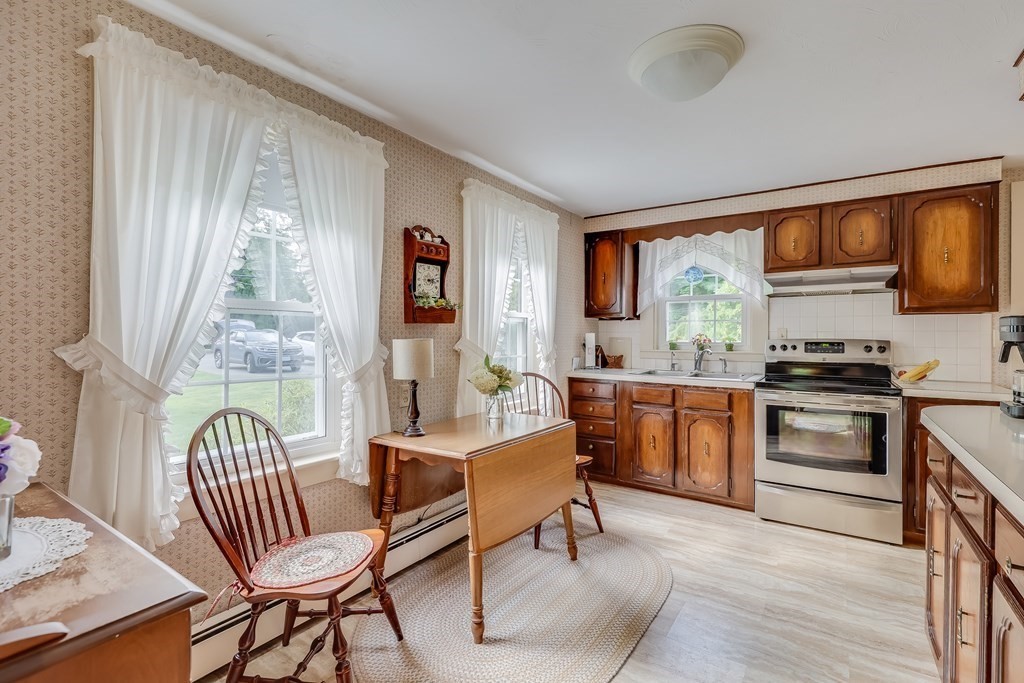 208 Osterville West Barnstable Road Barnstable, MA 02655 - Photo 9 of 27 a living room with furniture and a floor to ceiling window