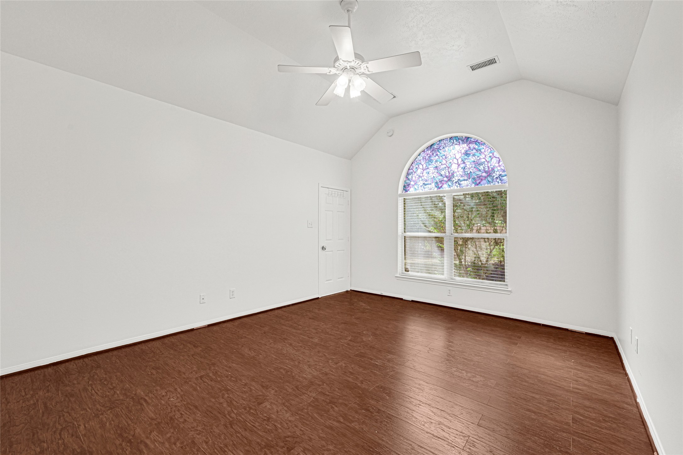 4807 Elm View Circle Houston, TX 77084 - Photo 15 of 27 an empty room with chandelier fan and windows