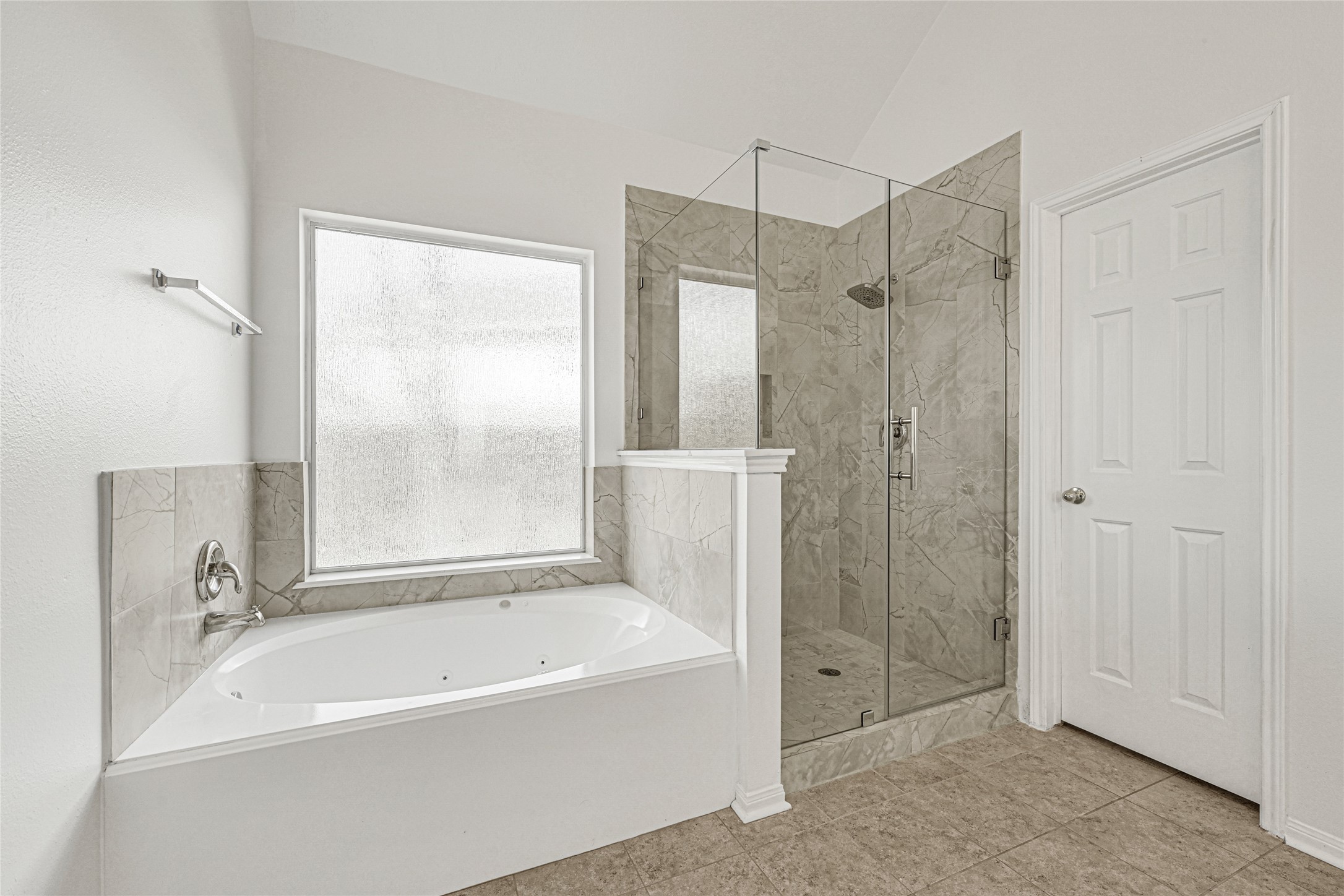 4807 Elm View Circle Houston, TX 77084 - Photo 17 of 27 a bathroom with a bathtub and a shower