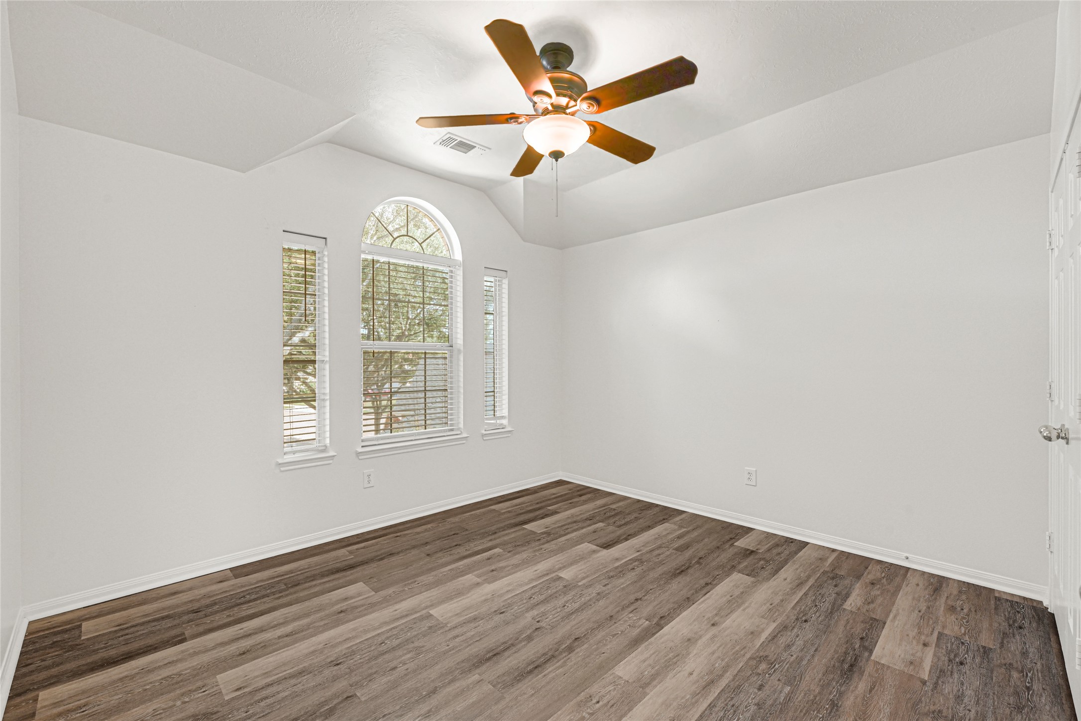 4807 Elm View Circle Houston, TX 77084 - Photo 22 of 27 wooden floor in an empty room with a window