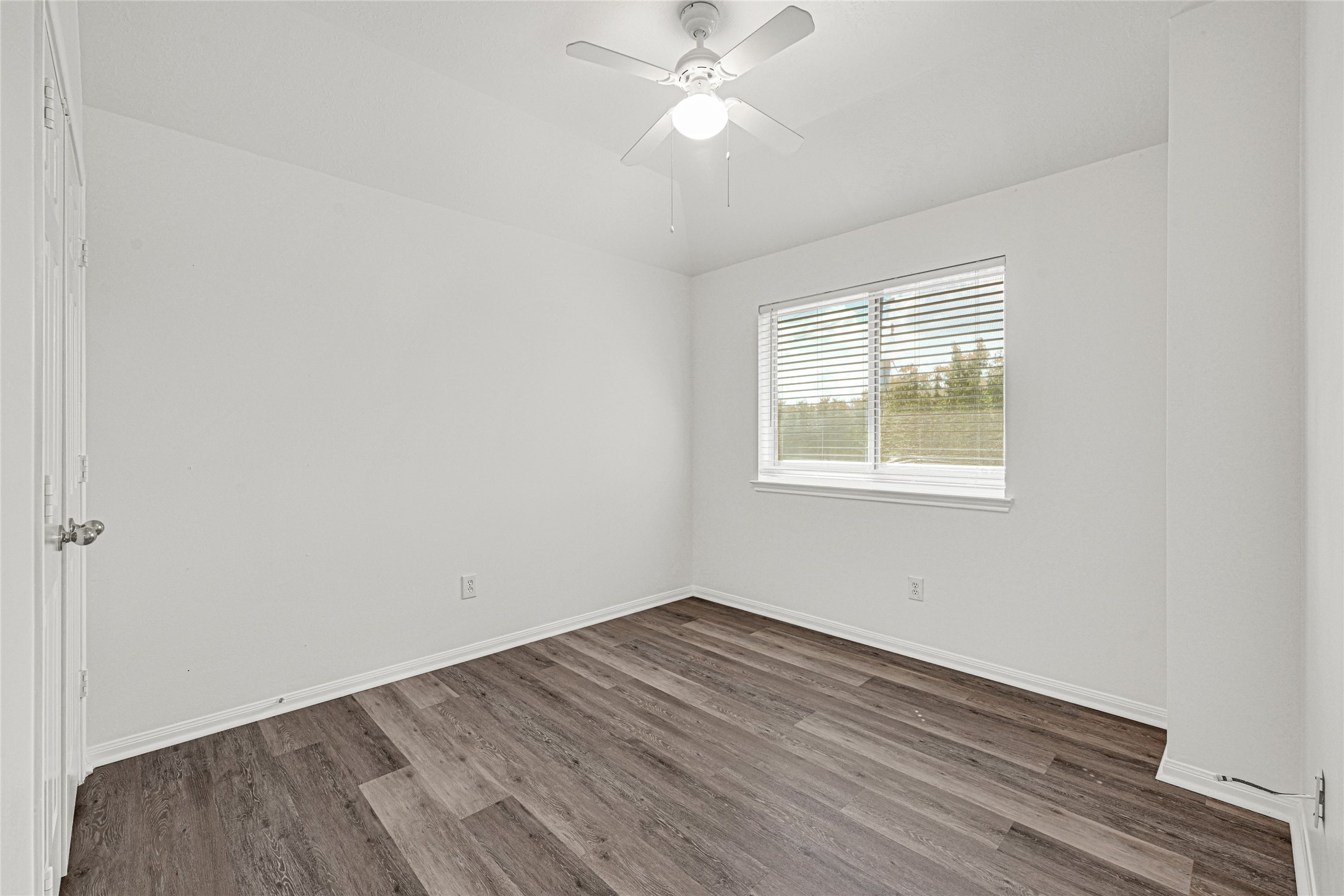 4807 Elm View Circle Houston, TX 77084 - Photo 23 of 27 wooden floor in an empty room with a window