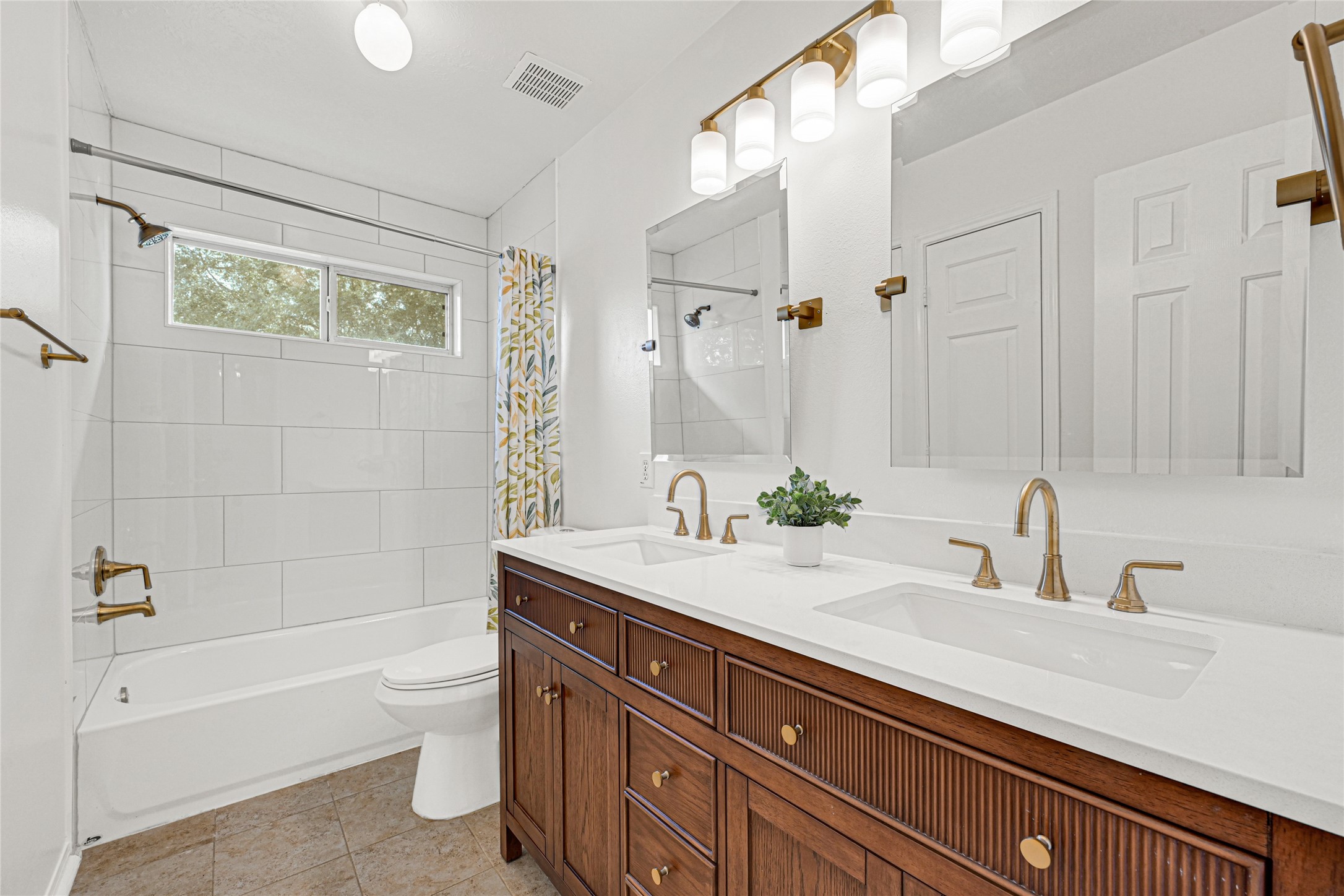4807 Elm View Circle Houston, TX 77084 - Photo 24 of 27 a bathroom with a granite countertop sink a toilet and bathtub