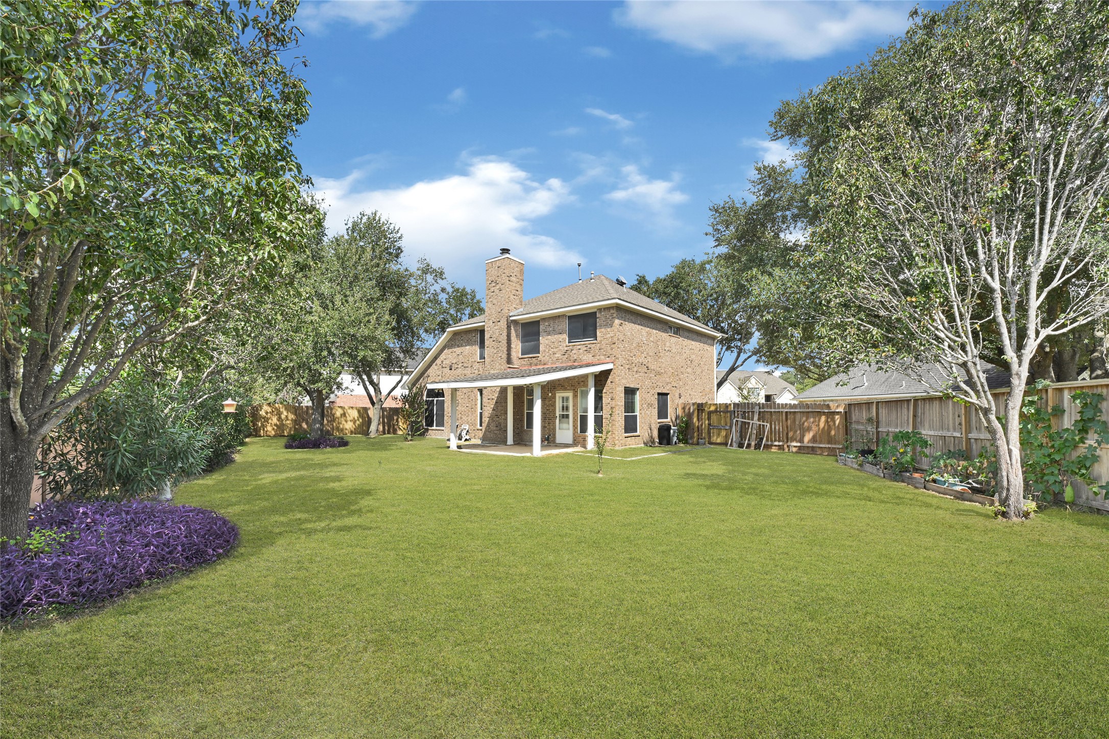 4807 Elm View Circle Houston, TX 77084 - Photo 26 of 27 a front view of a house with a garden