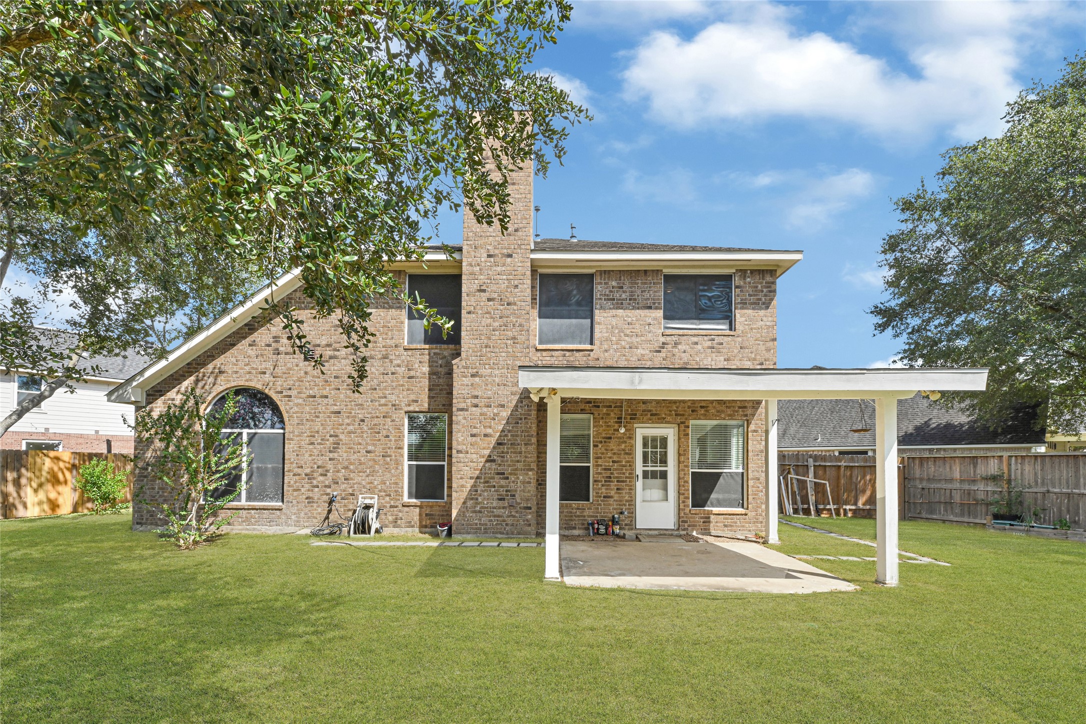 4807 Elm View Circle Houston, TX 77084 - Photo 27 of 27 a front view of a house with a garden and yard
