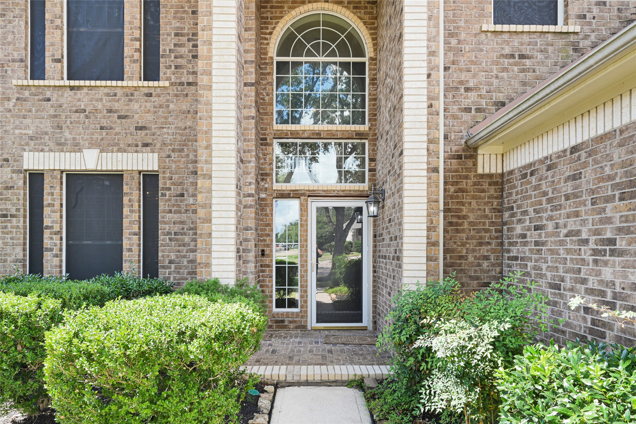 4807 Elm View Circle Houston, TX 77084 - Photo 3 of 27 a view of a brick house with large windows