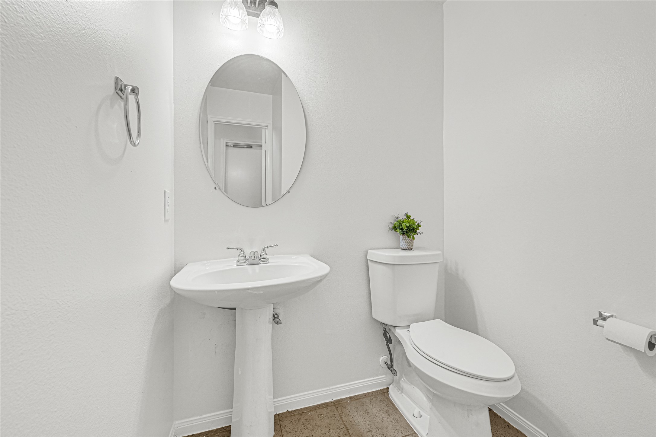 4807 Elm View Circle Houston, TX 77084 - Photo 7 of 27 a bathroom with a toilet a sink and a mirror