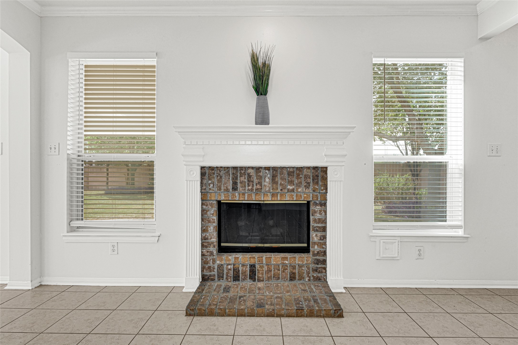 4807 Elm View Circle Houston, TX 77084 - Photo 10 of 27 a living room with a fireplace and a window