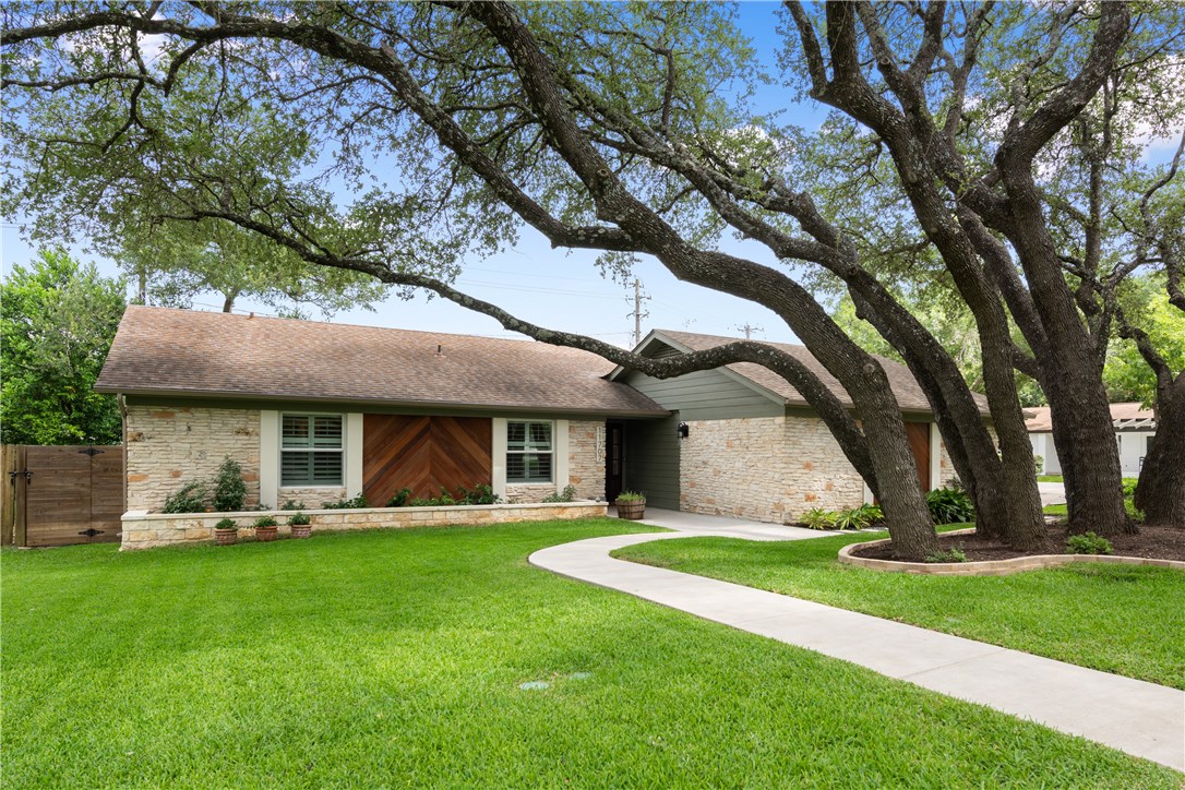 11707 Three Oaks Trail Austin, TX 78759 - Photo 1 of 1 a front view of house with yard and green space
