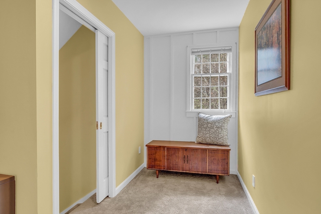 40 Bulkeley Road Littleton, MA 01460 - Photo 11 of 35 a room with a couch and a window