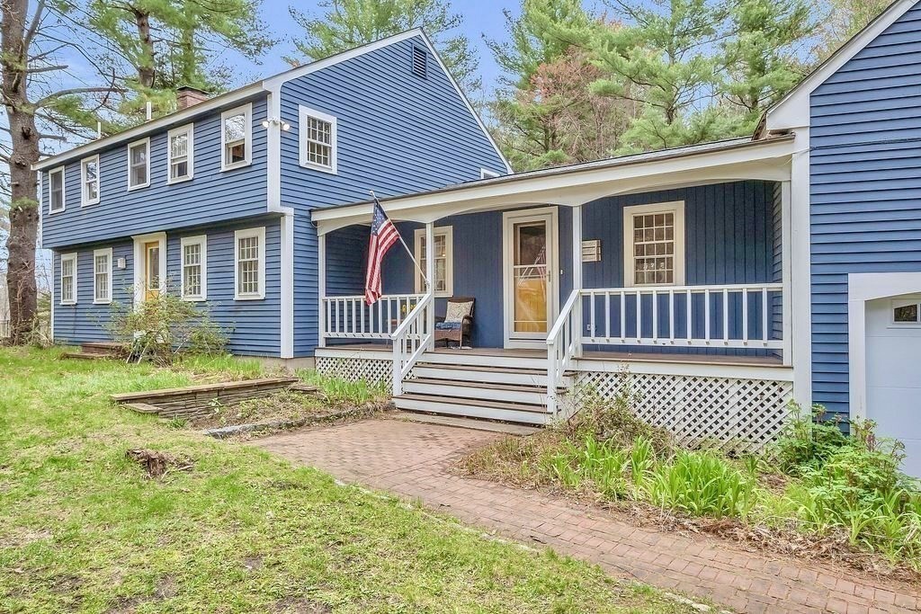 40 Bulkeley Road Littleton, MA 01460 - Photo 2 of 35 a front view of a house with garden