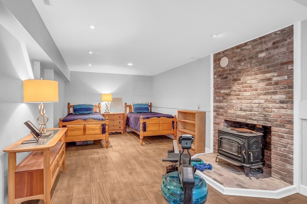40 Bulkeley Road Littleton, MA 01460 - Photo 27 of 35 a living room with furniture and a fireplace