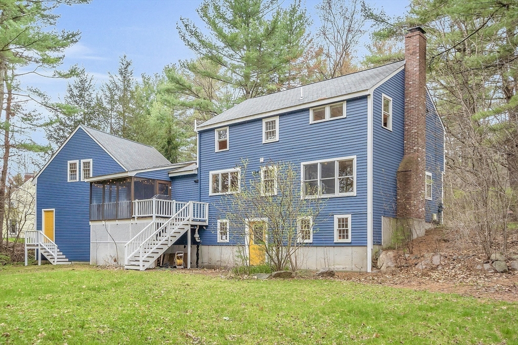 40 Bulkeley Road Littleton, MA 01460 - Photo 30 of 35 a view of a house with a yard