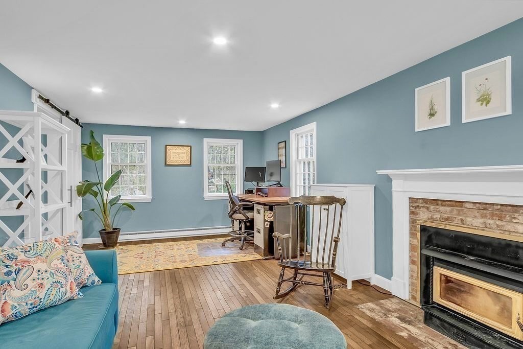 40 Bulkeley Road Littleton, MA 01460 - Photo 4 of 35 a living room with furniture and a fireplace