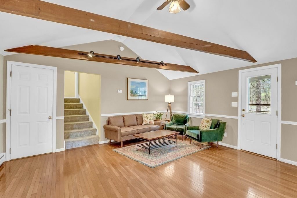 40 Bulkeley Road Littleton, MA 01460 - Photo 10 of 35 a living room with furniture and a wooden floor