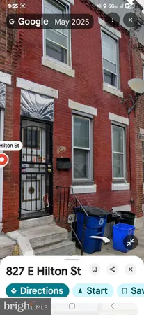 a view of a brick building with many windows
