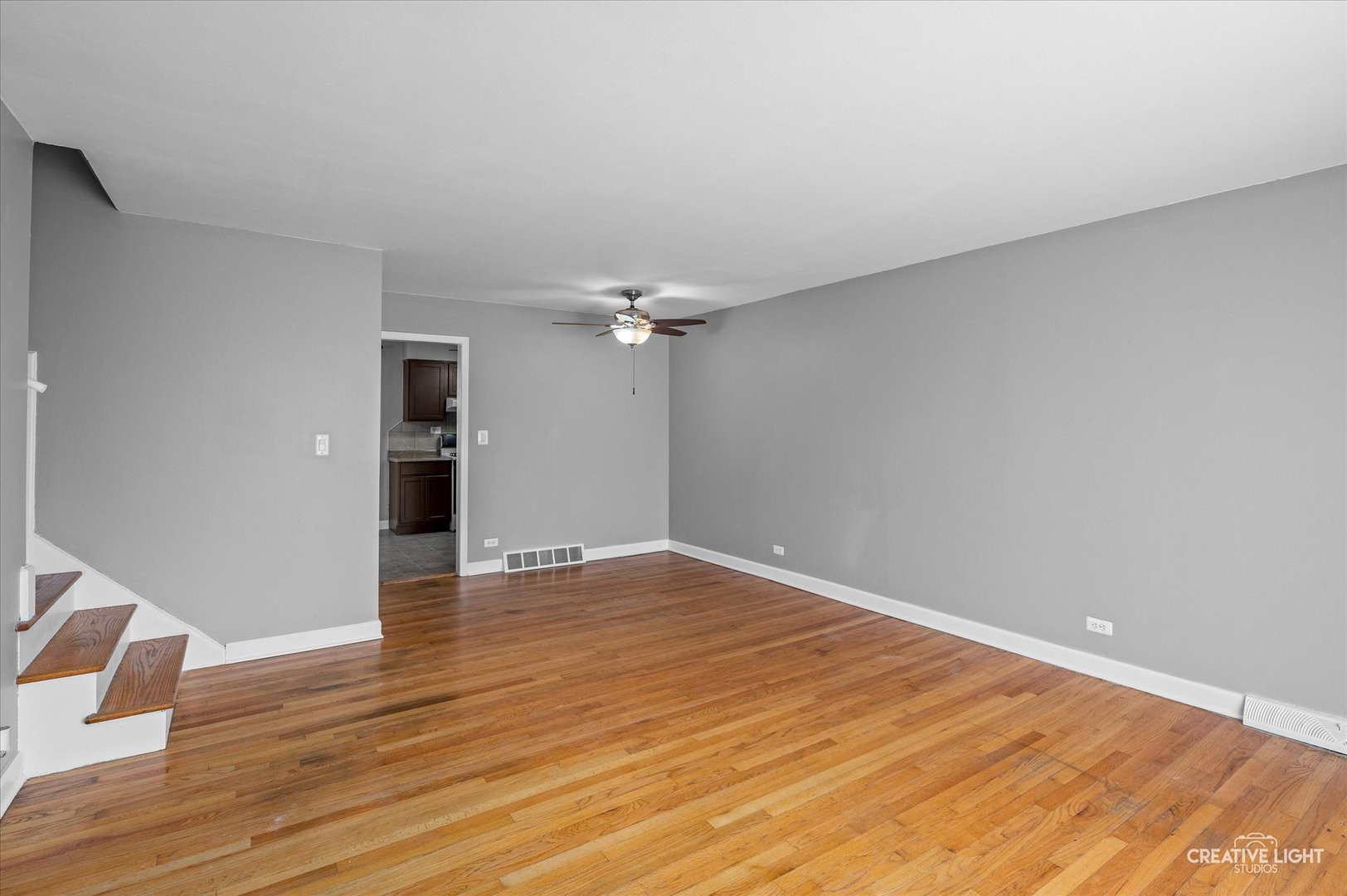 8802 Prospect Street Niles, IL 60714 - Photo 3 of 20 a view of empty room with wooden floor