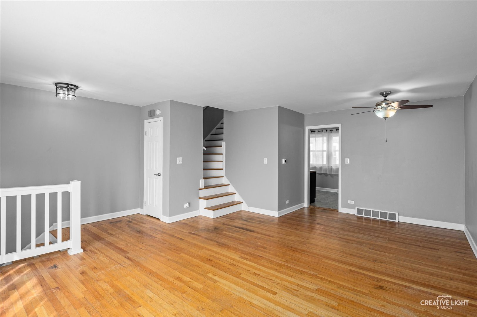 8802 Prospect Street Niles, IL 60714 - Photo 5 of 20 a view of an empty room with wooden floor