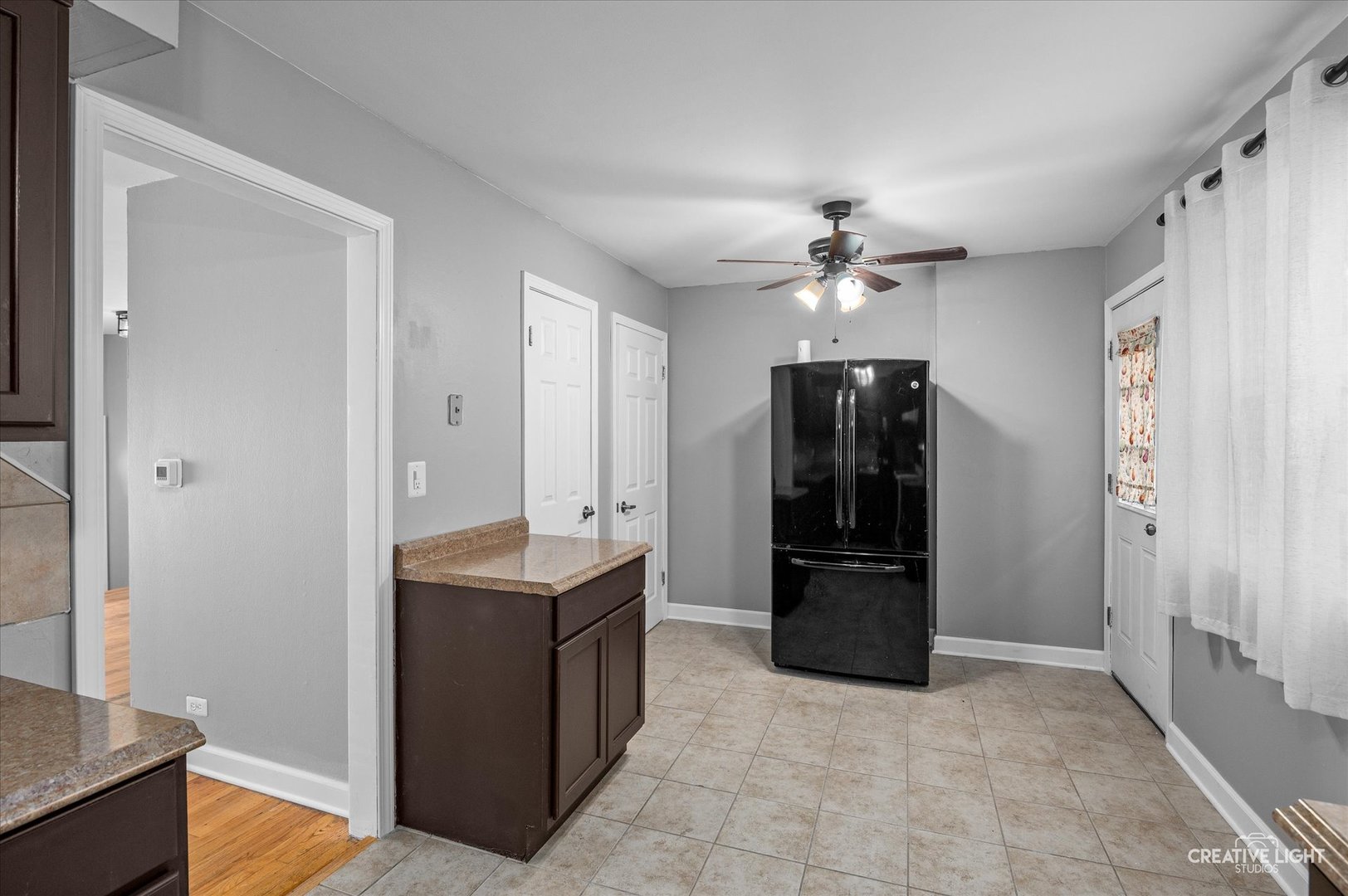 8802 Prospect Street Niles, IL 60714 - Photo 8 of 20 a kitchen with a refrigerator and a sink