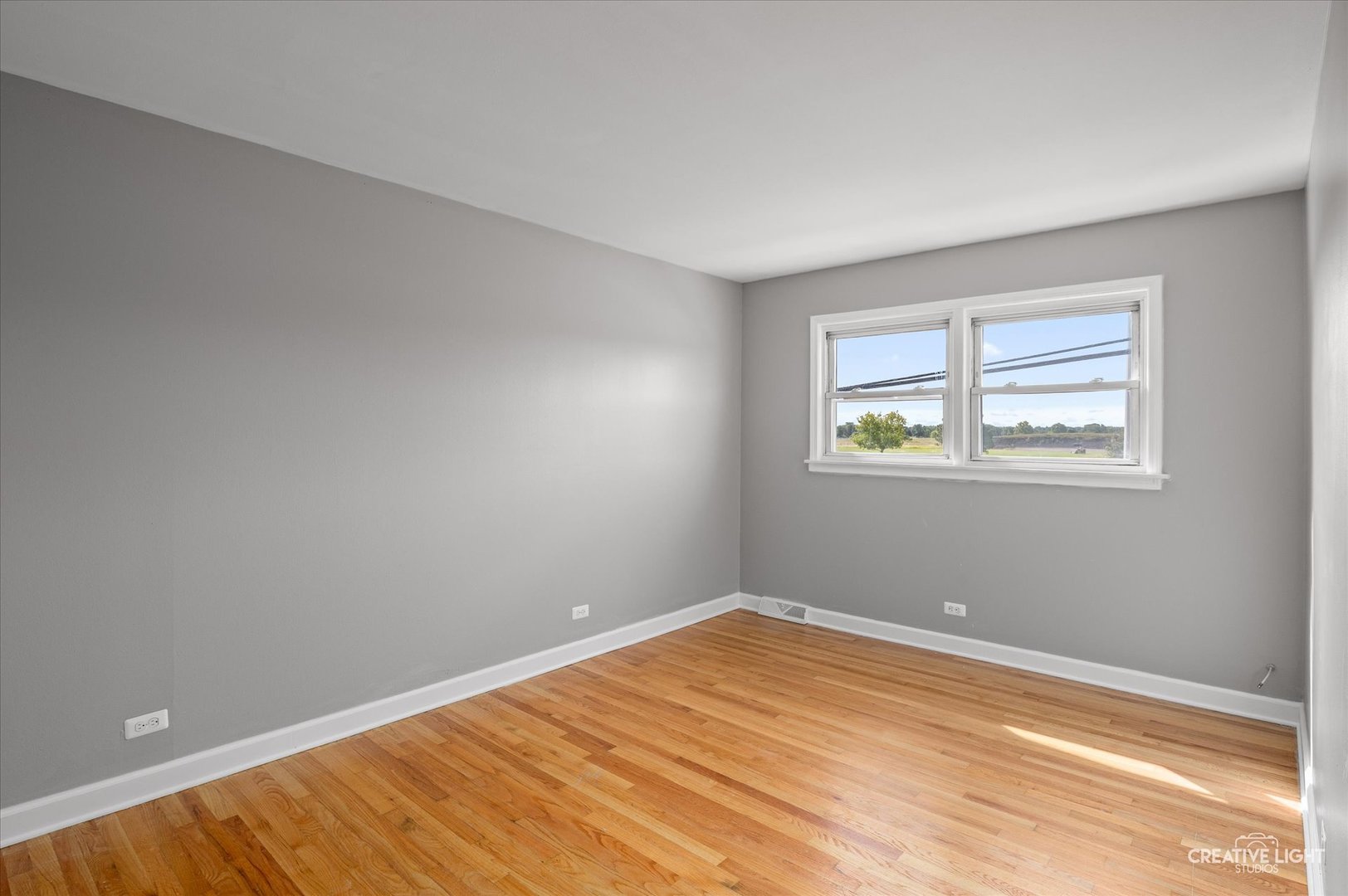 8802 Prospect Street Niles, IL 60714 - Photo 10 of 20 a view of a room with wooden floor and window