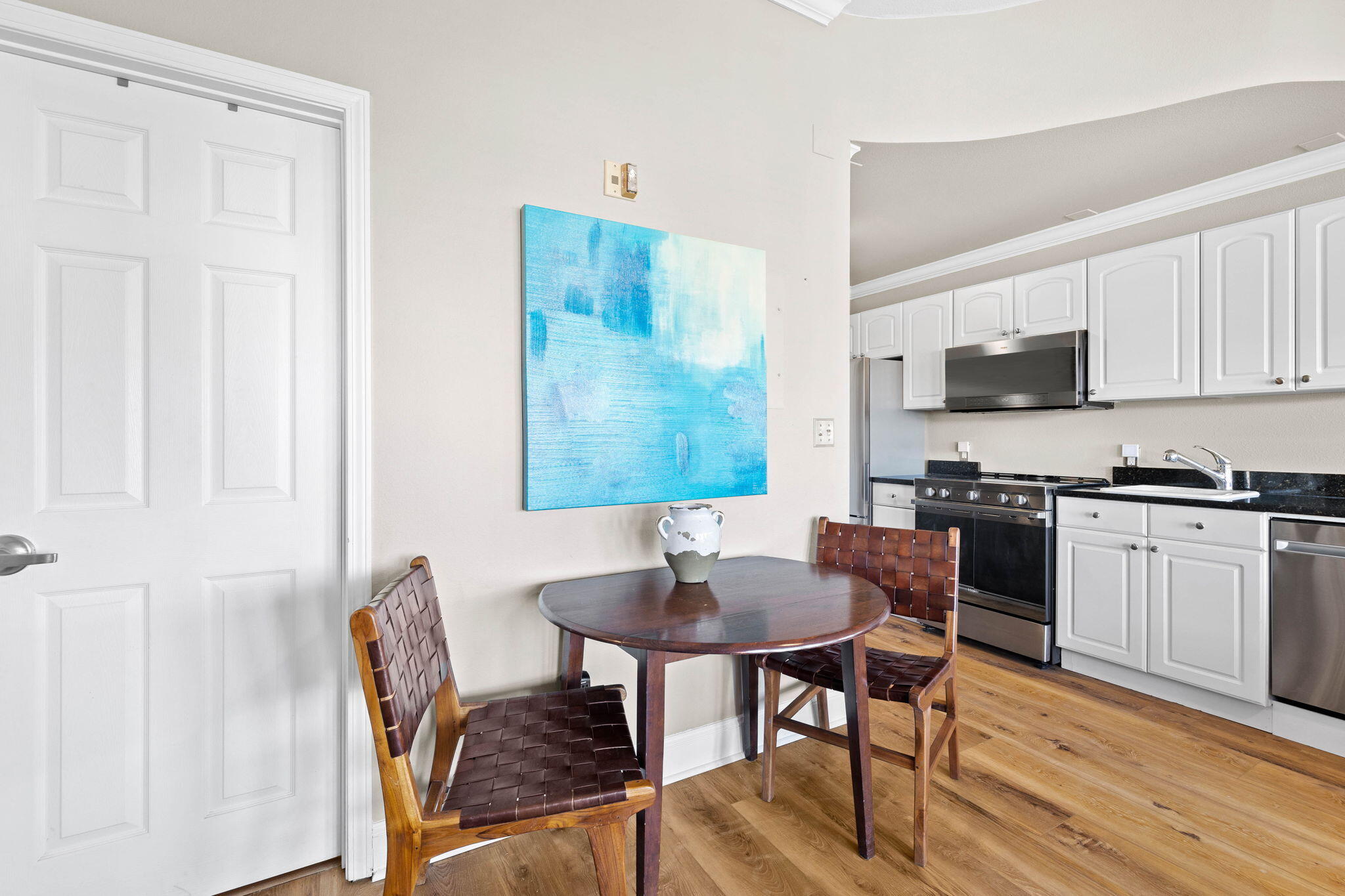 45 Town Center Loop, Unit 416 Santa Rosa Beach, FL 32459 - Photo 16 of 32 a kitchen with stainless steel appliances granite countertop a stove top oven a sink a counter space and cabinets