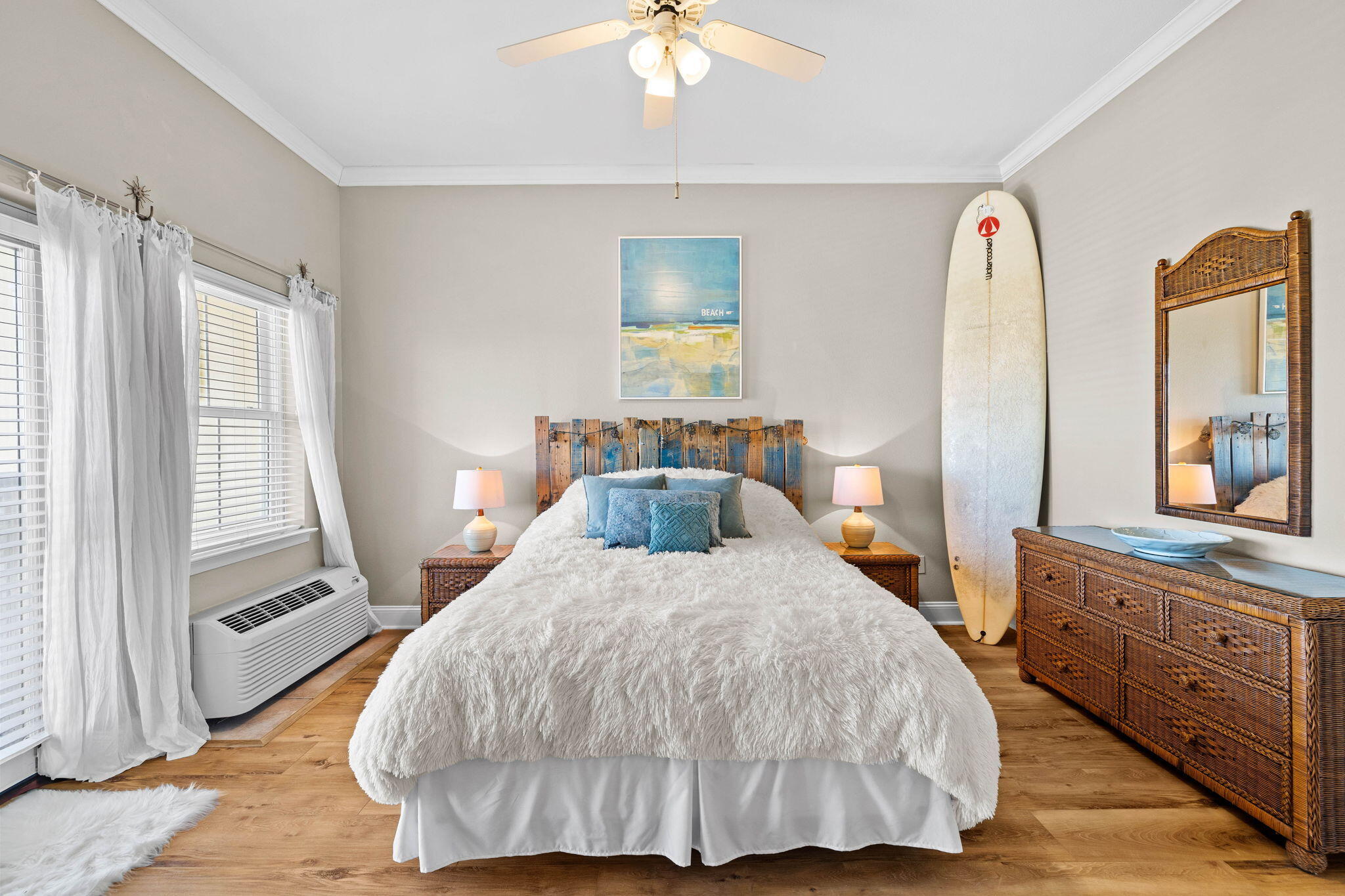 45 Town Center Loop, Unit 416 Santa Rosa Beach, FL 32459 - Photo 18 of 32 a bedroom with a bed and a chandelier